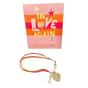 M VTG YSL Yves Saint Laurent In Love Again Gold Heart Logo Charm Ribbon Bracelet